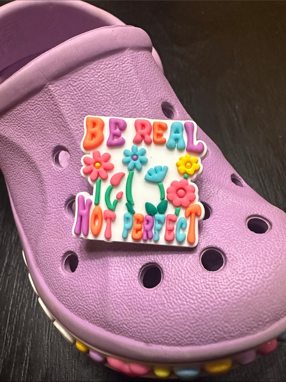 Charm 'Be Real Not Perfect'. Search JIBBITZ in my closet to buy more and save!